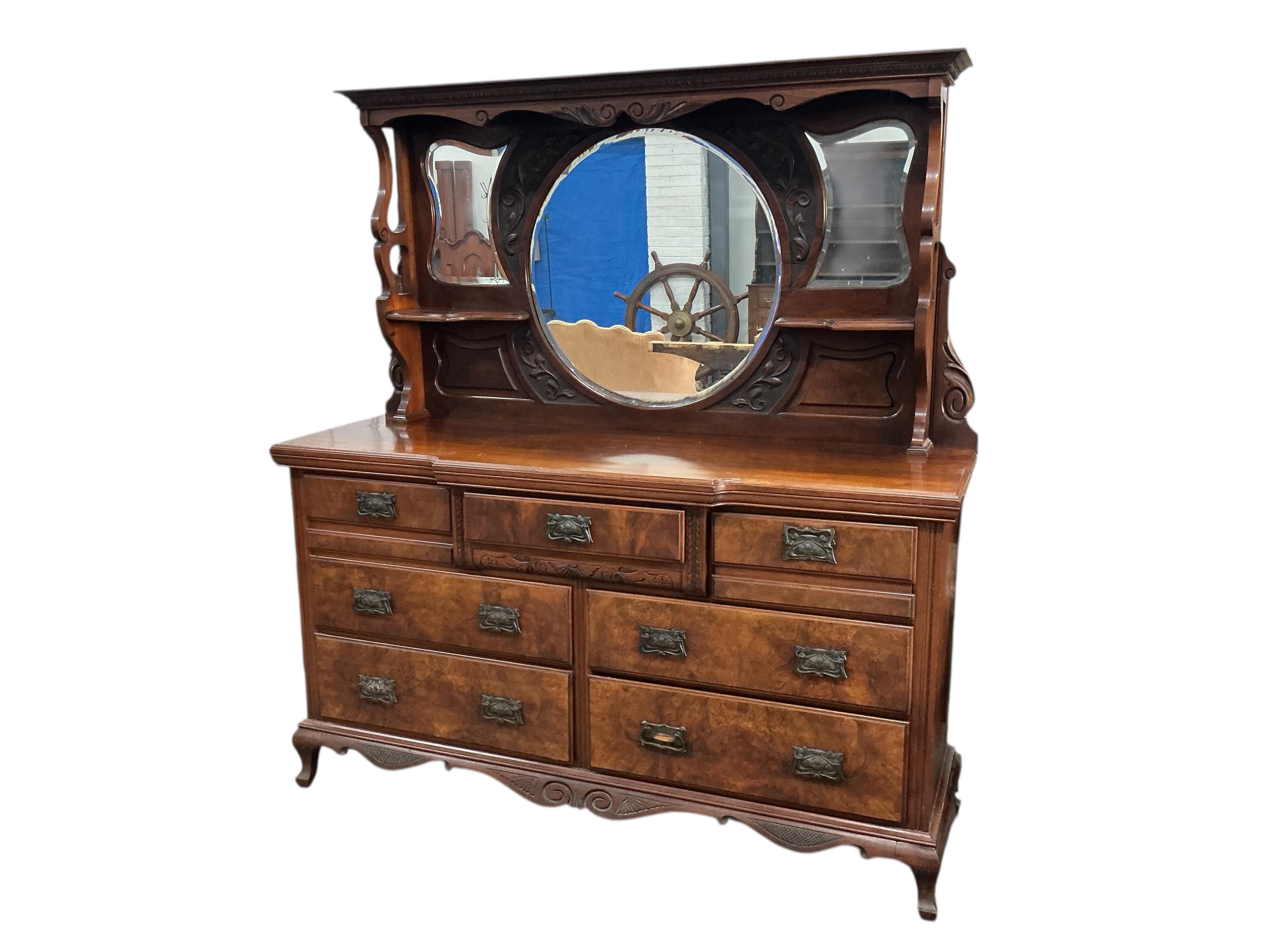 A late Victorian mirrored back walnut sideboard, width 170cm, depth 52cm, height 184cm